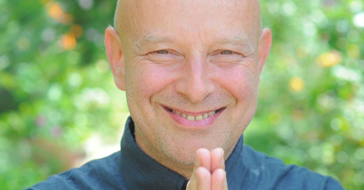 Filmmaker and meditation teacher Michel Pascal with hands together